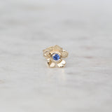 Gold forget me not flower stud with a Ceylon blue sapphire