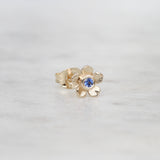 Gold forget me not flower stud with a blue sapphire