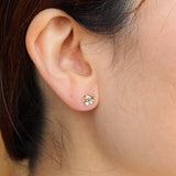 Gold forget me not flower stud with a blue sapphire