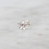Silver forget me not flower stud with a pink sapphire