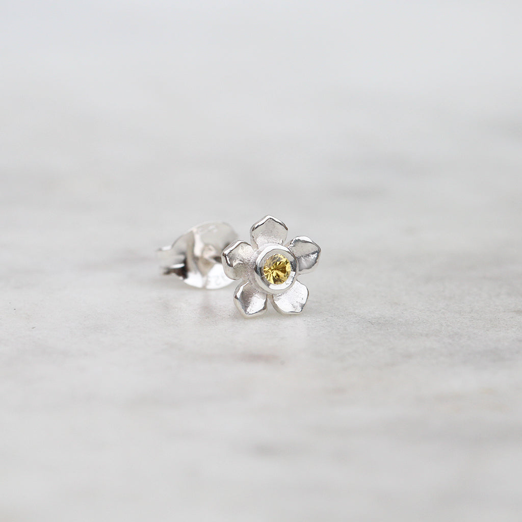 Forget me not flower stud with a yellow sapphire in sterling silver