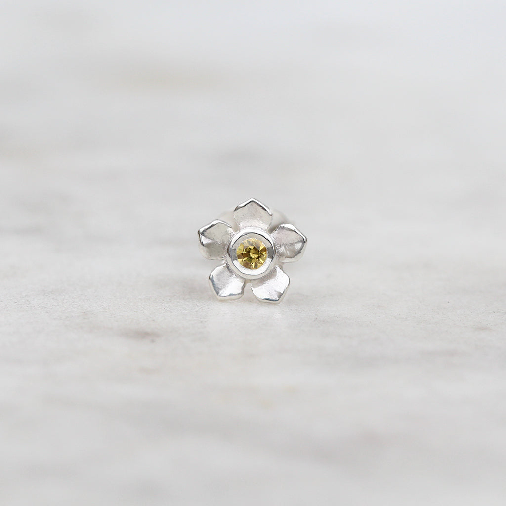 Forget me not flower stud with a yellow sapphire
