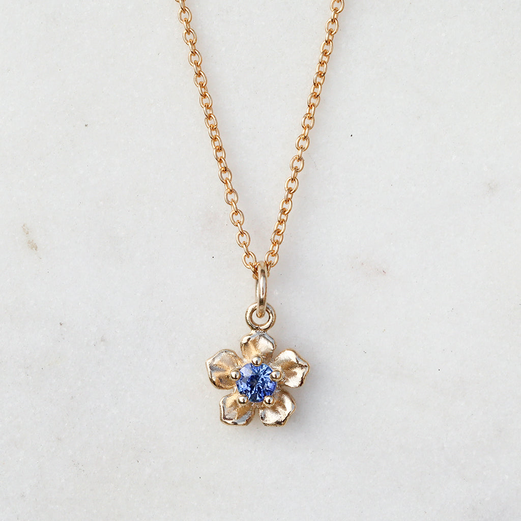 gold sapphire forget me not flower necklace