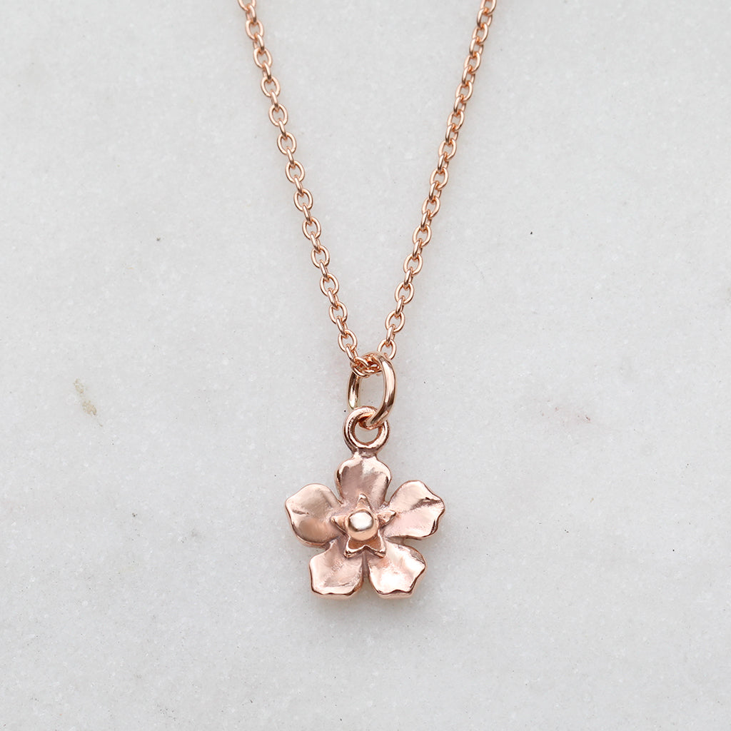 Rose gold forget me not flower necklace