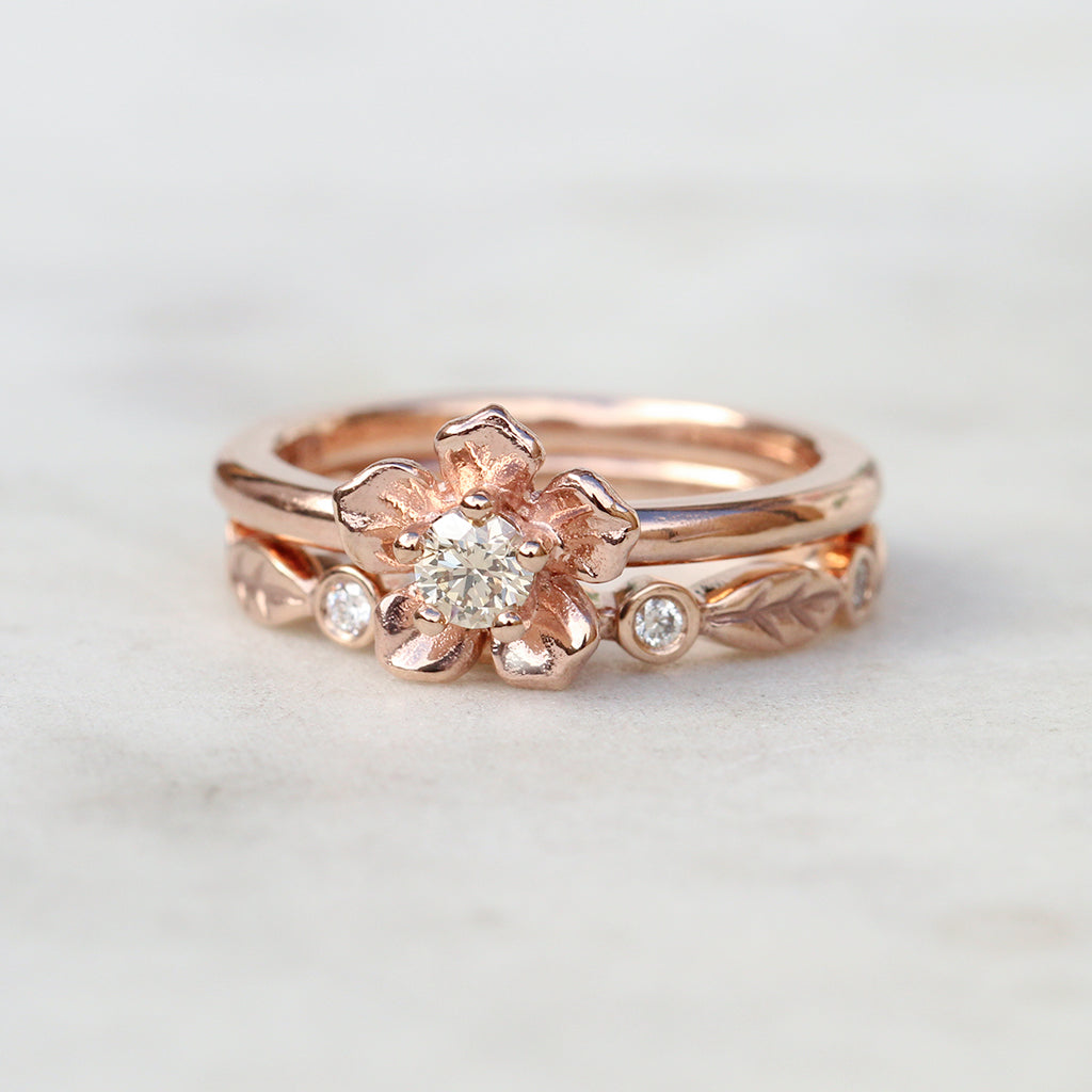 Forget me not ring with a diamond leaf band in rose gold