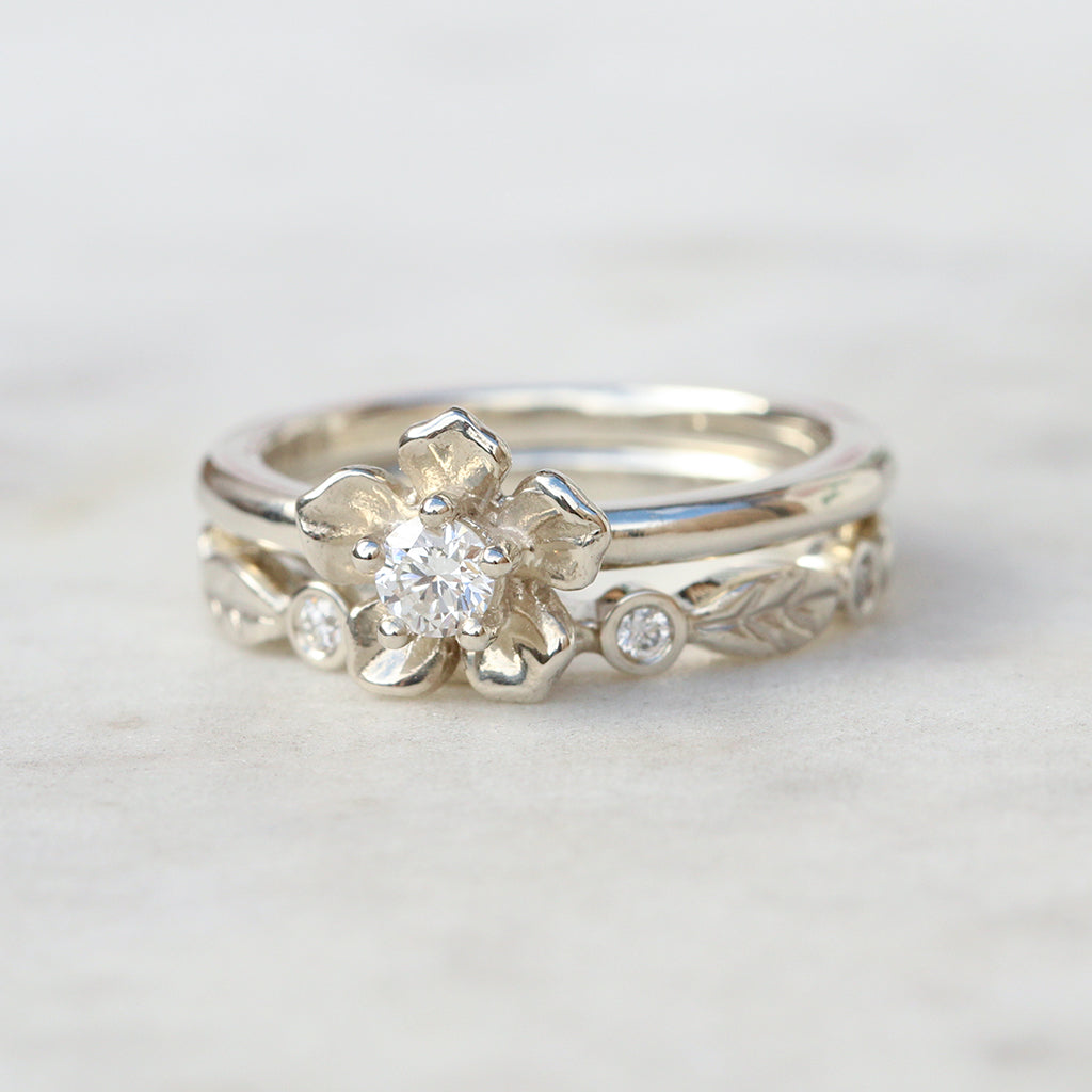 forget me not flower ring and diamond leaf ring in white gold