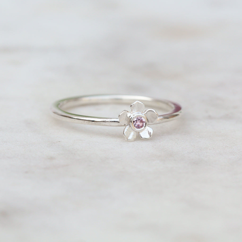 Forget me not flower ring with a pink sapphire
