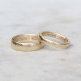 Gold hammered wedding rings engraved