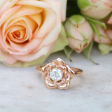 Rose gold rose ring with a diamond