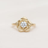Gold rose ring with a diamond