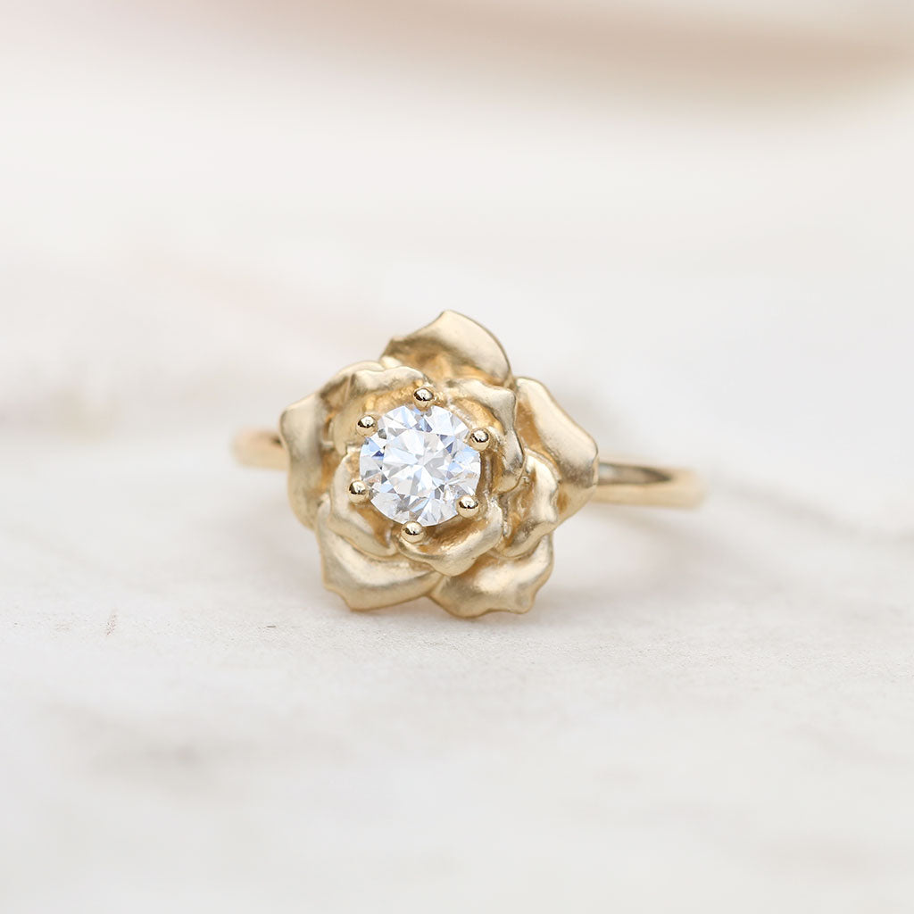 Gold rose ring with a diamond