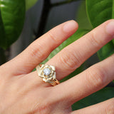 rose engagement ring with a leaf ring in gold
