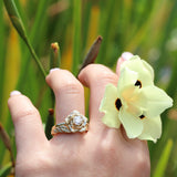 Rose diamond engagement ring with a leaf wedding ring in gold
