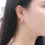 Lily earrings in gold and silver