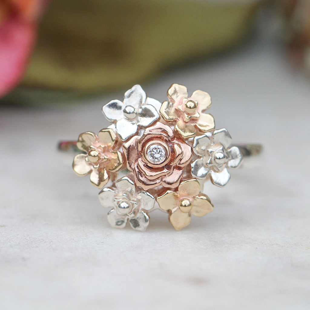 Delicate floral ring with a central diamond