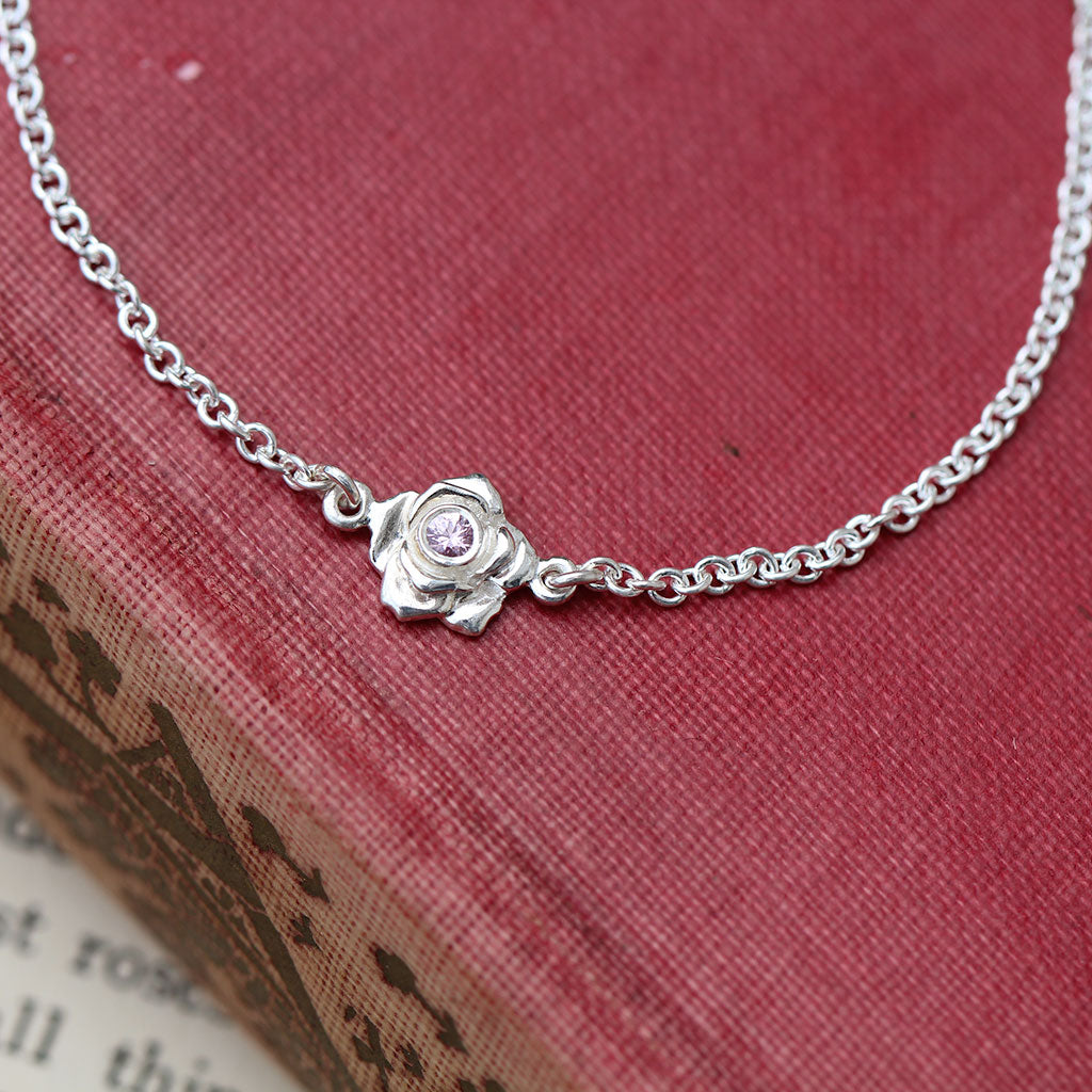 Silver rose bracelet with a pink sapphire