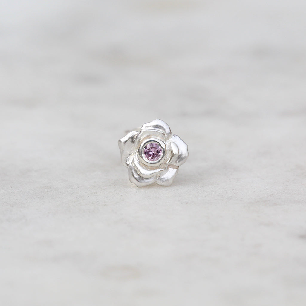 Silver rose stud with a pink sapphire