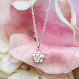 Rose necklace with a pink sapphire in sterling silver