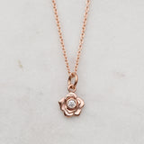 Rose gold rose necklace with a diamond