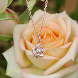 Rose gold rose necklace with a diamond