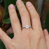 Silver rose ring with a blue sapphire