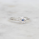 Silver rose ring with a blue sapphire