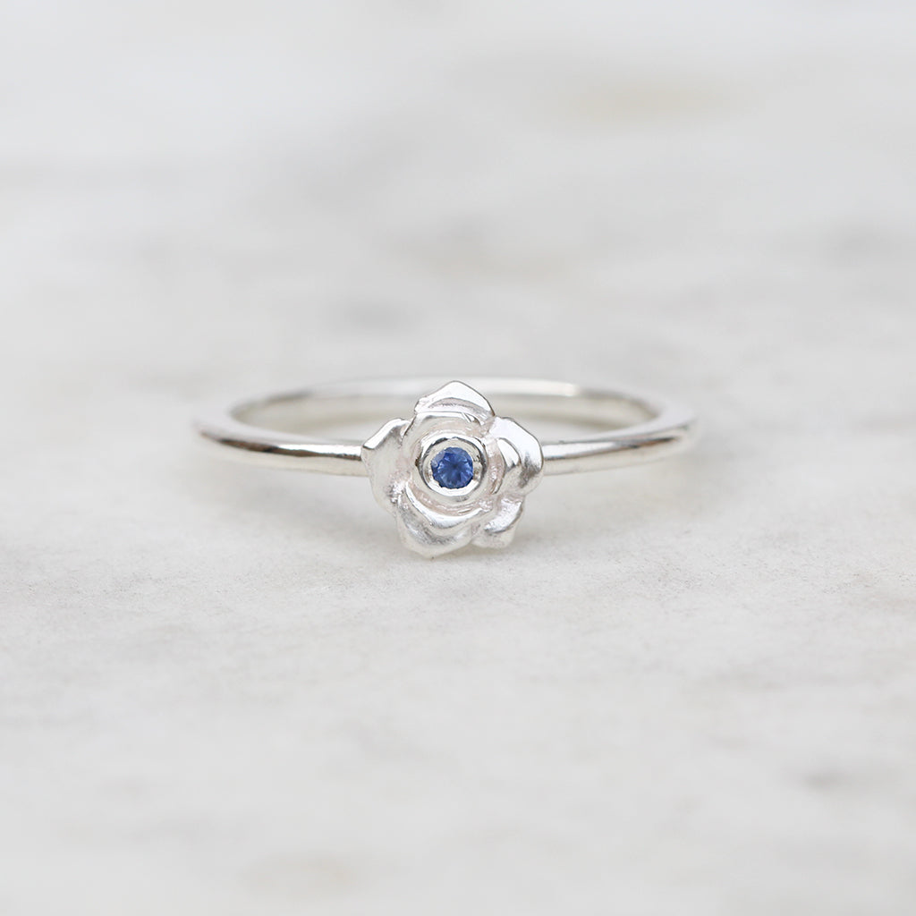 Silver rose ring with a Ceylon blue sapphire