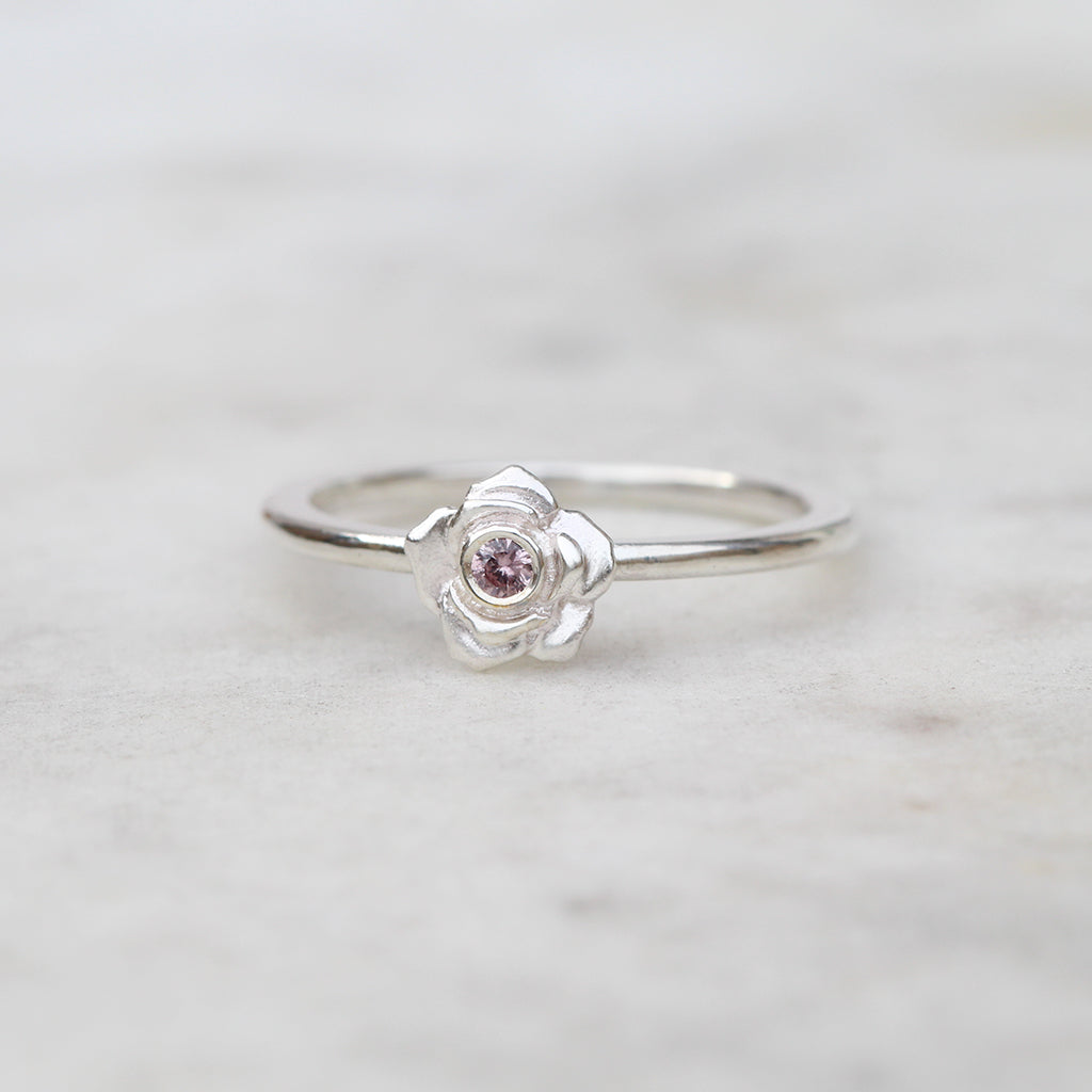 Silver rose ring with a pink sapphire