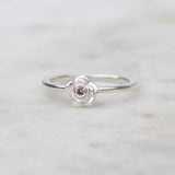 Silver rose ring with a pink sapphire