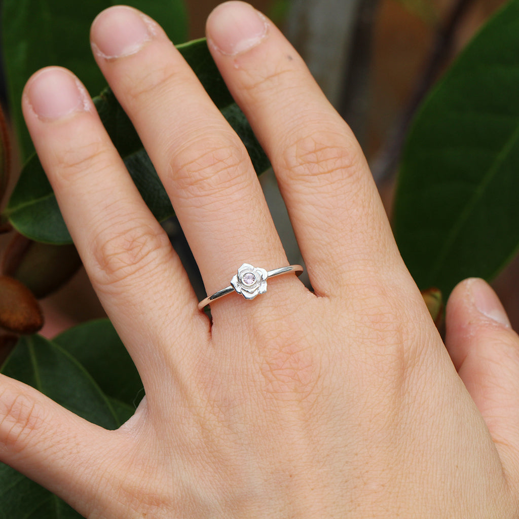 Silver rose ring with a pink sapphire