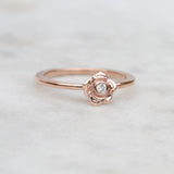 rose ring with a diamond in rose gold