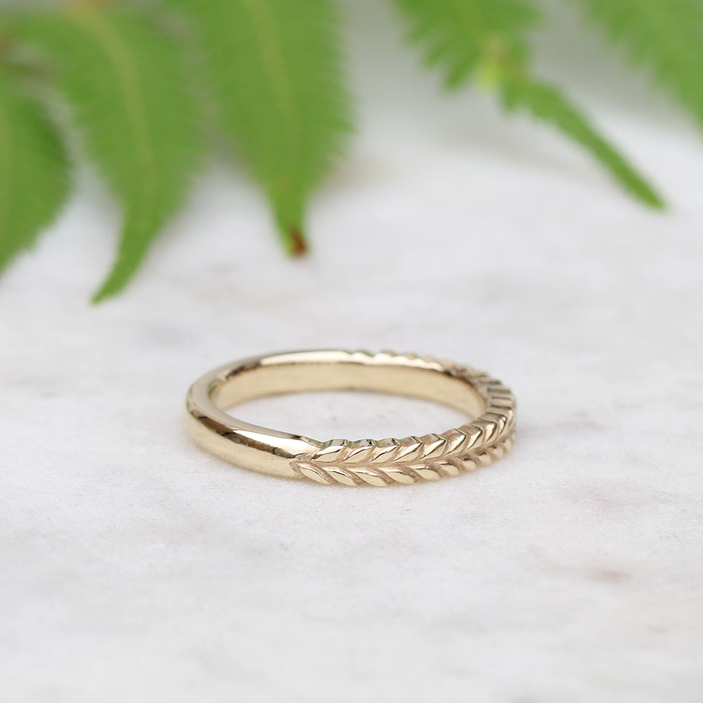 Silver fern ring in gold