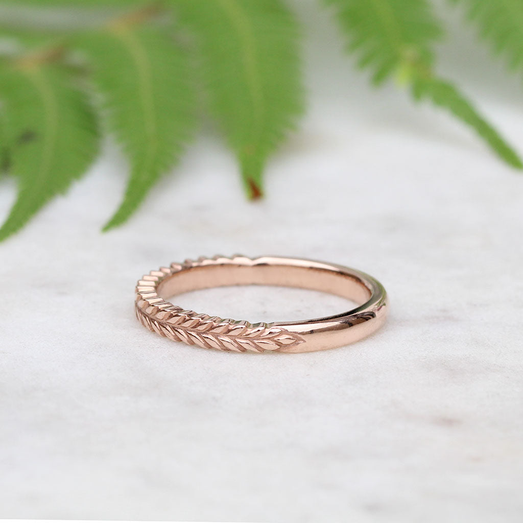 Silver fern wedding ring in rose gold
