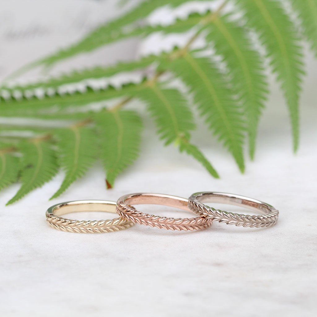 Silver fern wedding rings in yellow gold, rose gold and white gold