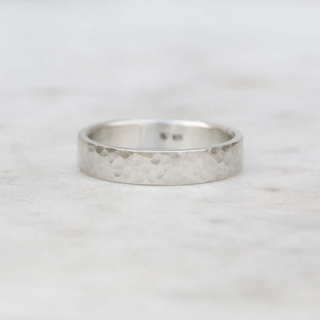Wide hammered ring with a flat profile