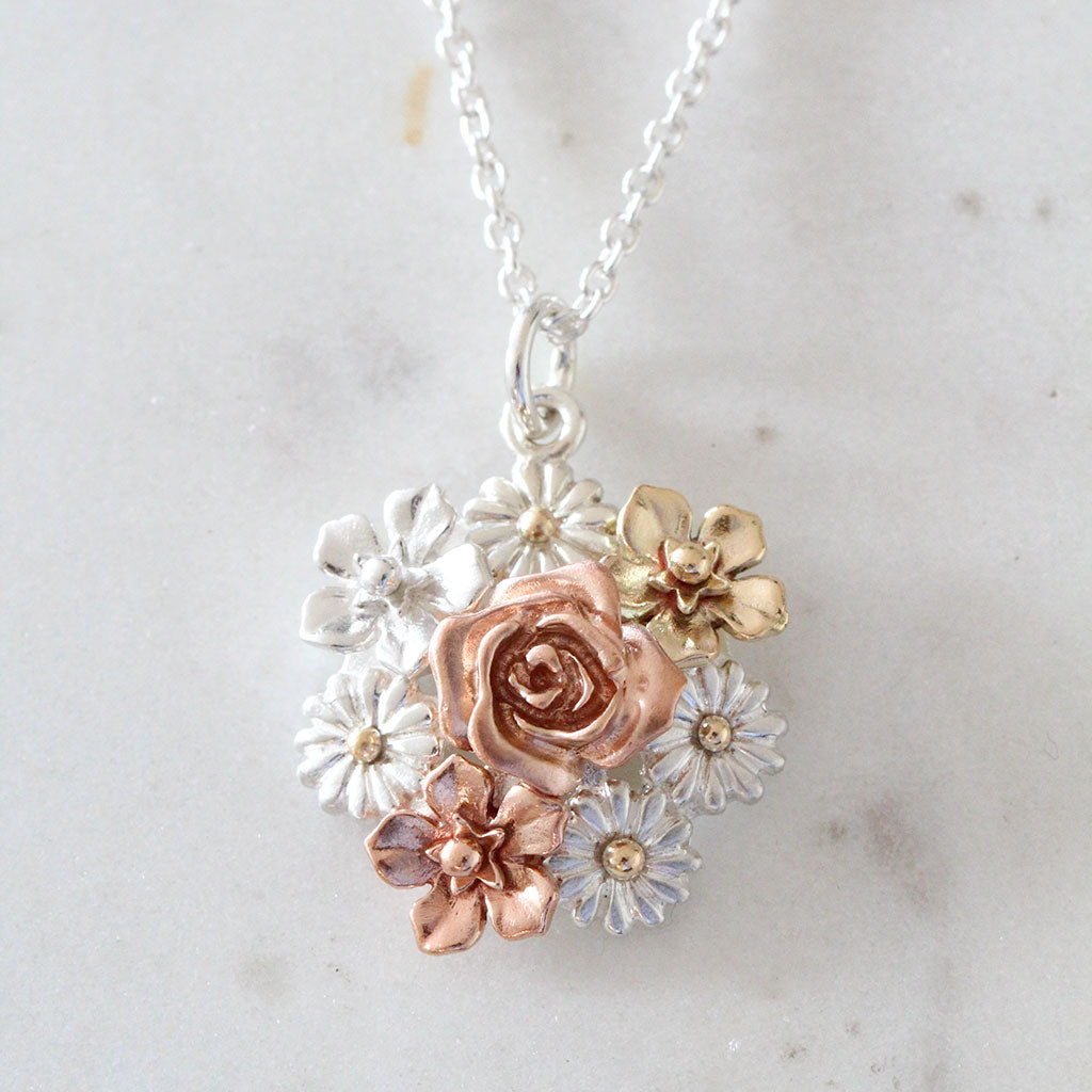 flower bouquet necklace in gold and silver
