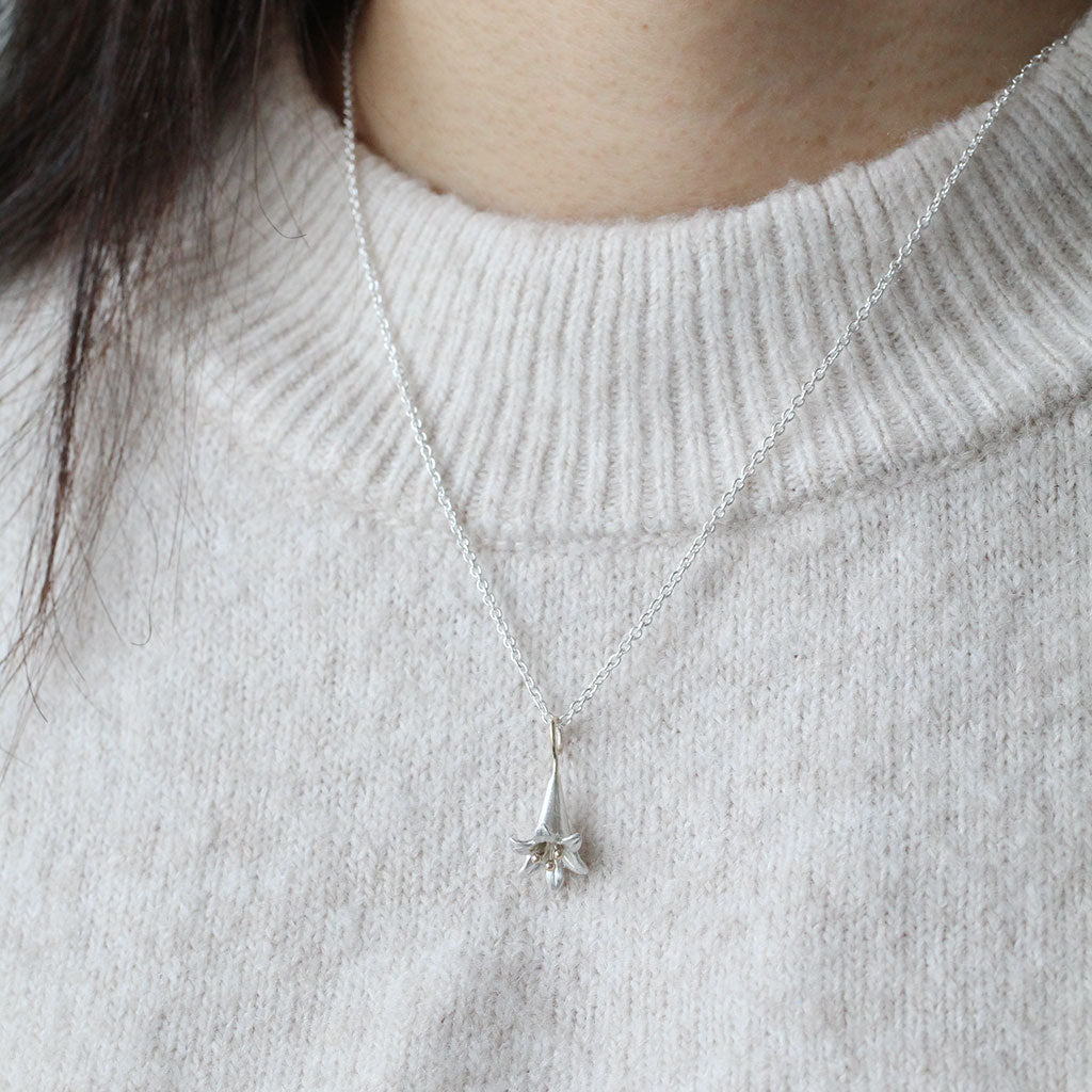 lily pendant in gold and silver