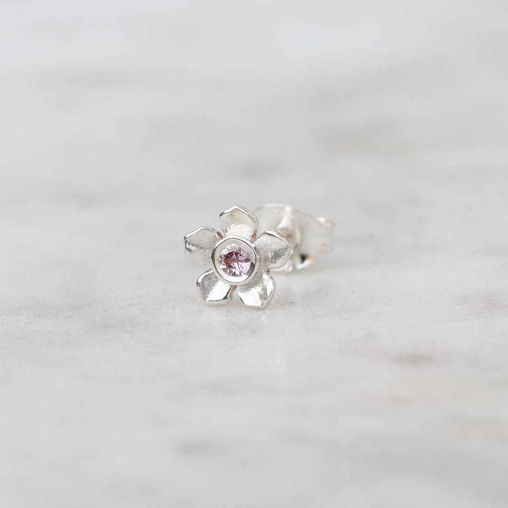 Silver forget me not flower stud with a pink sapphire