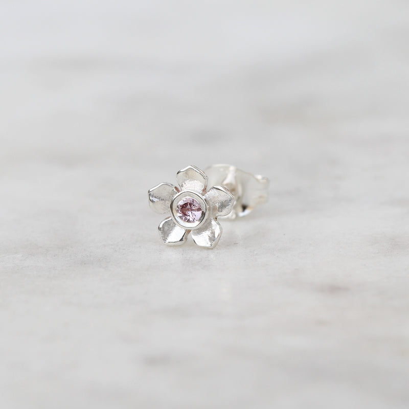 Silver forget me not flower stud with a pink sapphire
