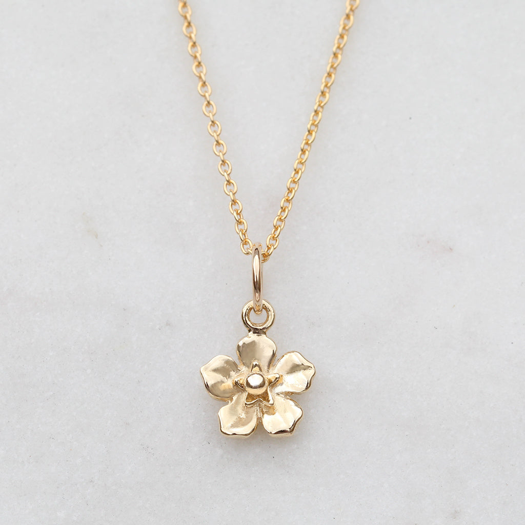 Gold forget me not flower necklace