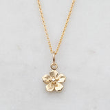 Gold forget me not flower necklace