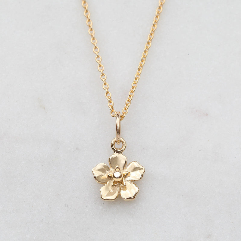 Gold forget me not flower necklace