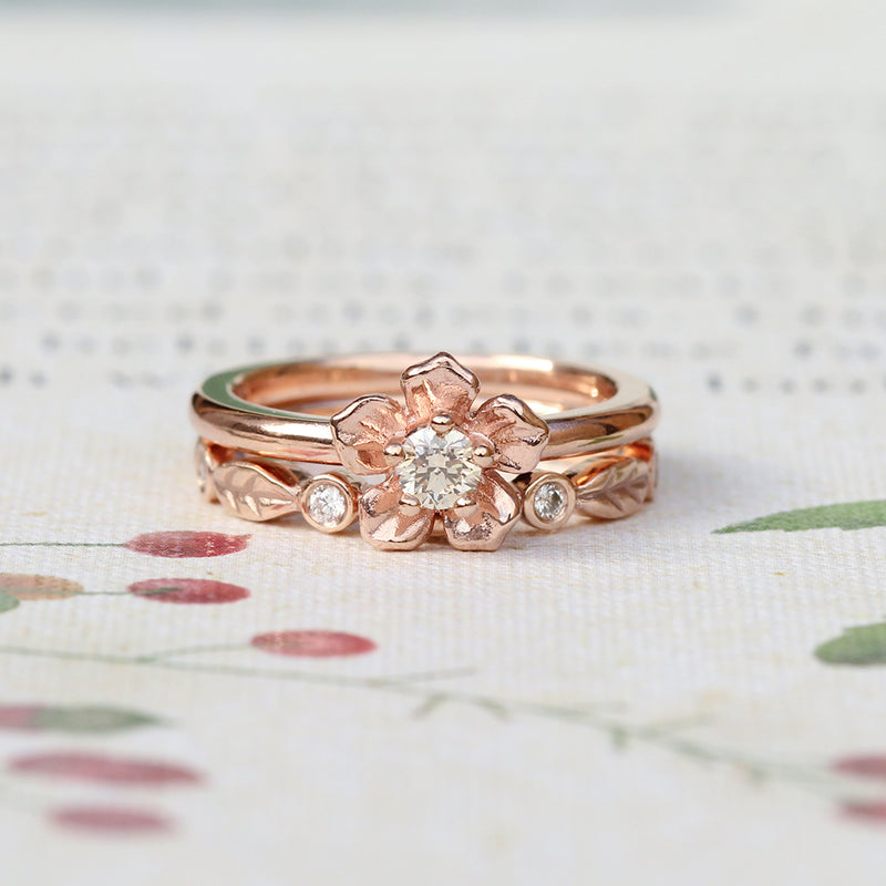 forget me not flower engagement ring with a diamond leaf wedding band