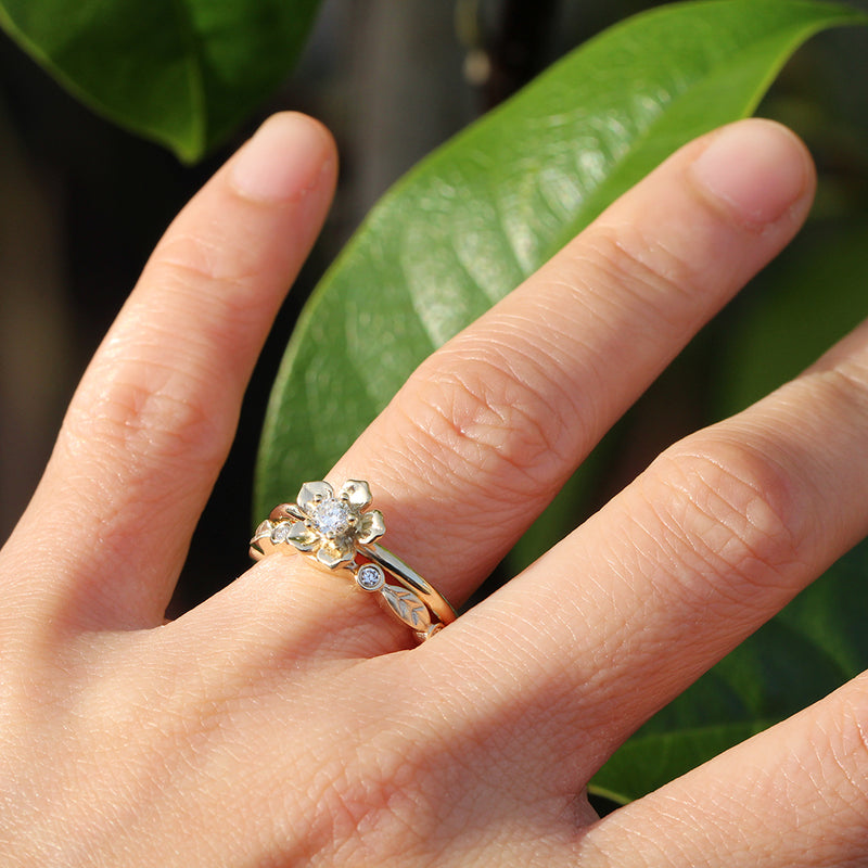 forget me not flower engagement ring with a diamond leaf band
