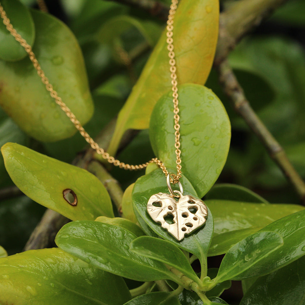 gold kawakawa leaf pendant