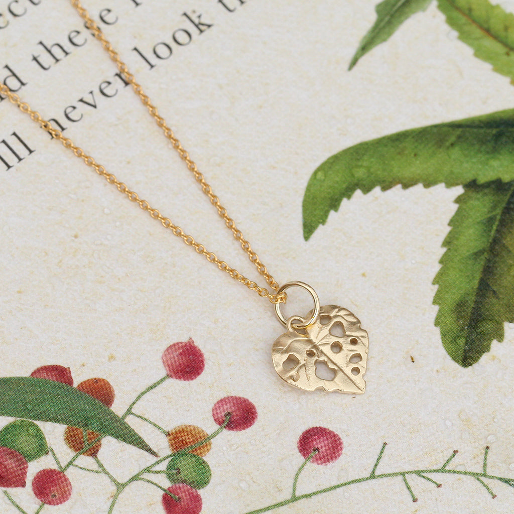 gold kawakawa leaf pendant