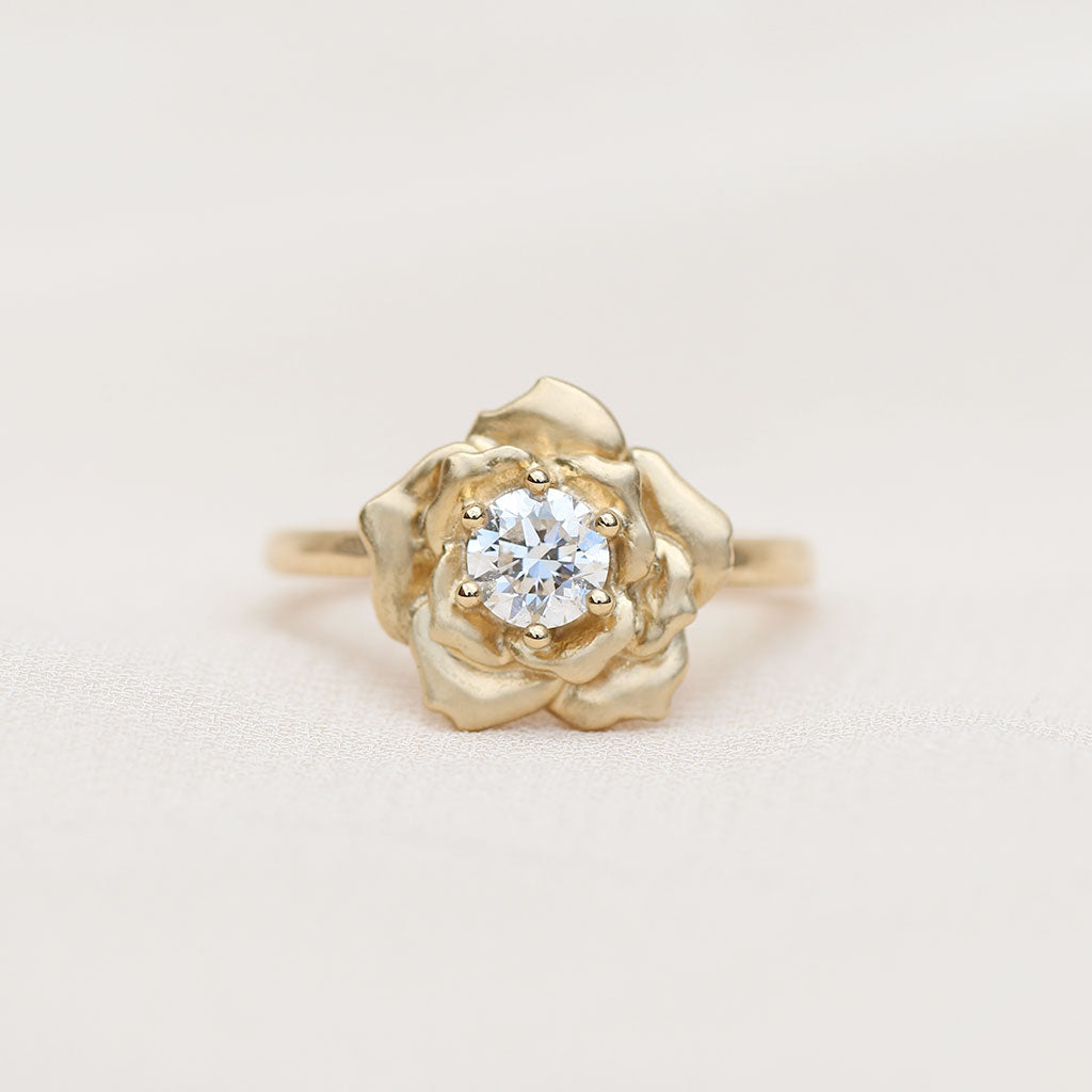 Gold rose ring with a diamond