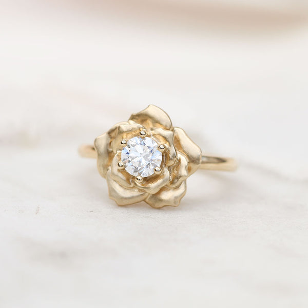 Gold rose ring with a diamond
