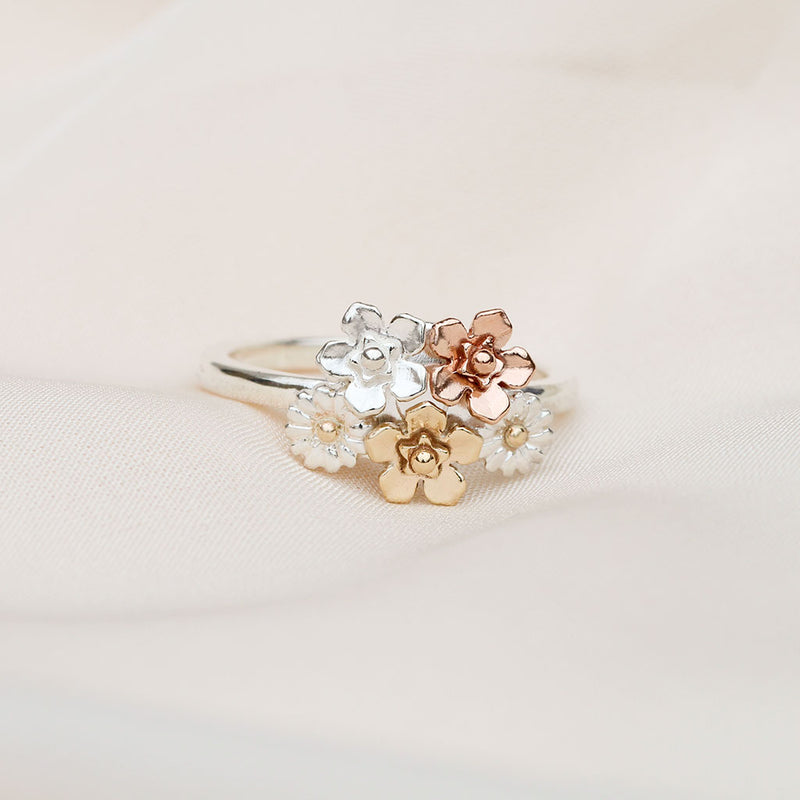 Floral ring with silver, rose gold, and yellow gold