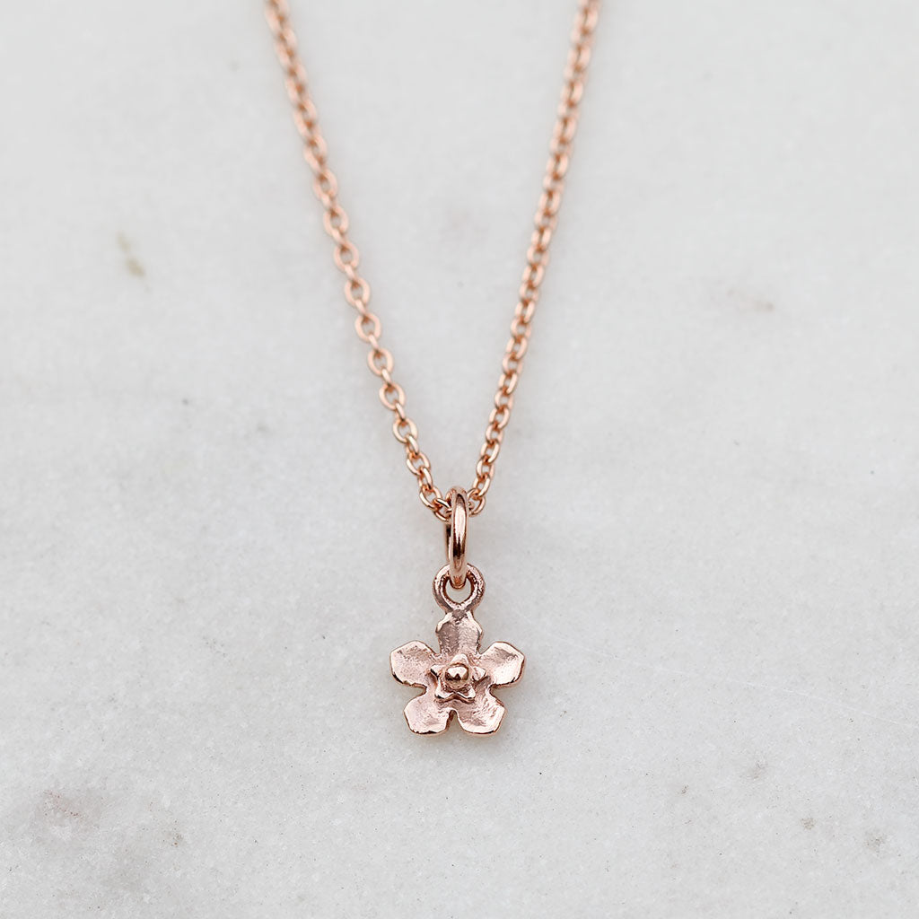 Rose gold petite forget me not flower necklace